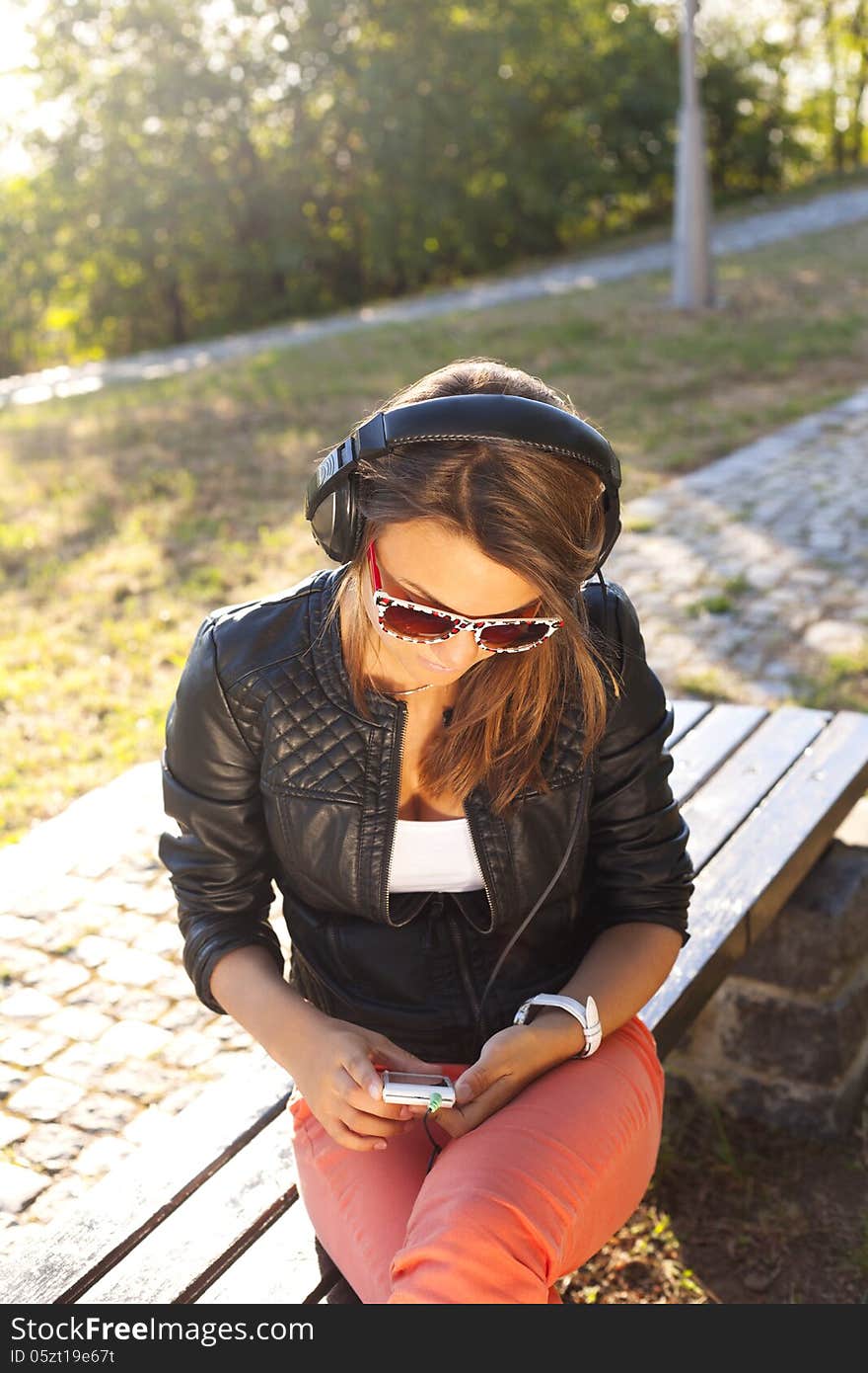 Young woman enjoying music-happy girl