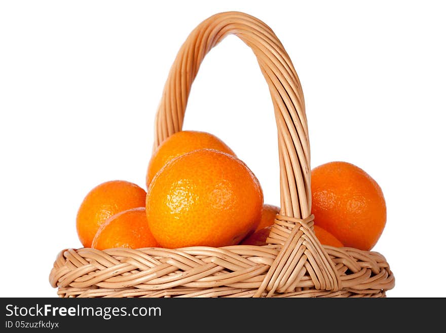 Basket of fresh oranges, mandarines or tangerines on white background. Basket of fresh oranges, mandarines or tangerines on white background