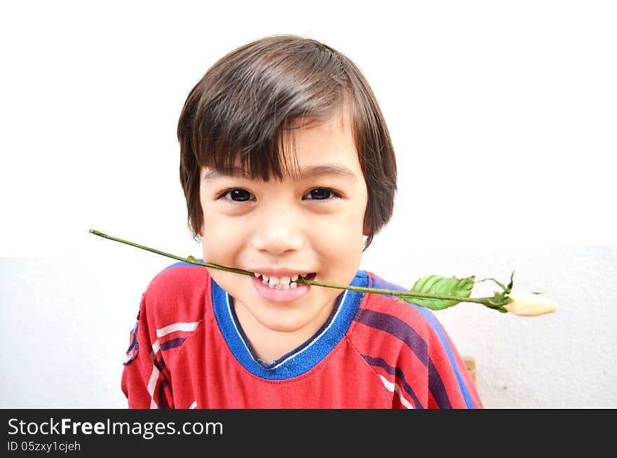 Little boy smiling with flower portrait