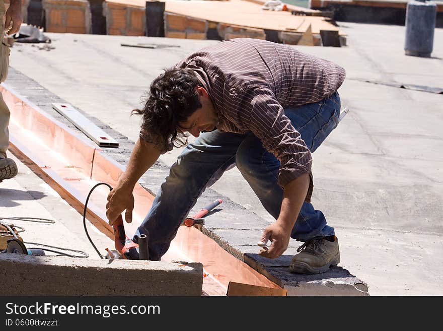 Building worker at work in a site building