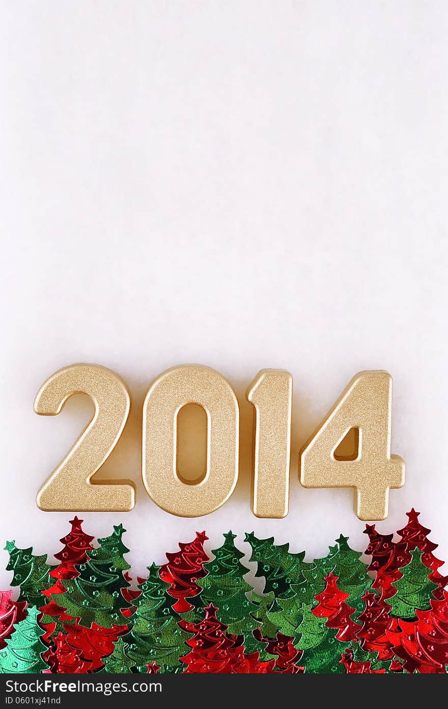 2014 year golden figures and varicolored confettii in the form of Christmas trees