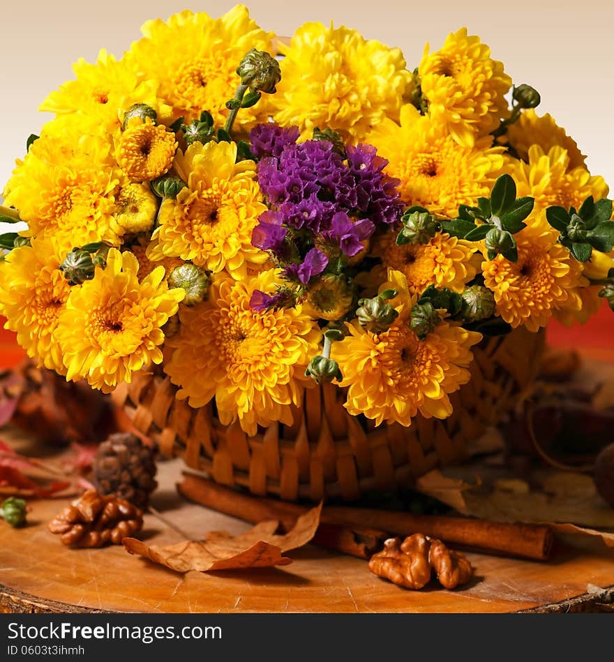 Still life with colorful autumn flowers in rustic decor