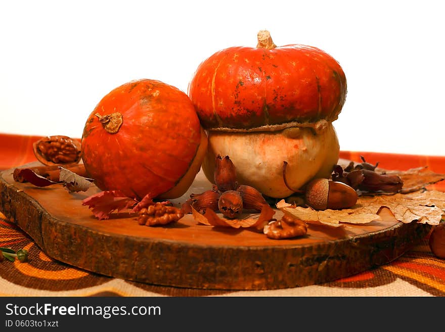 Pumpkins sitting on fall leaves