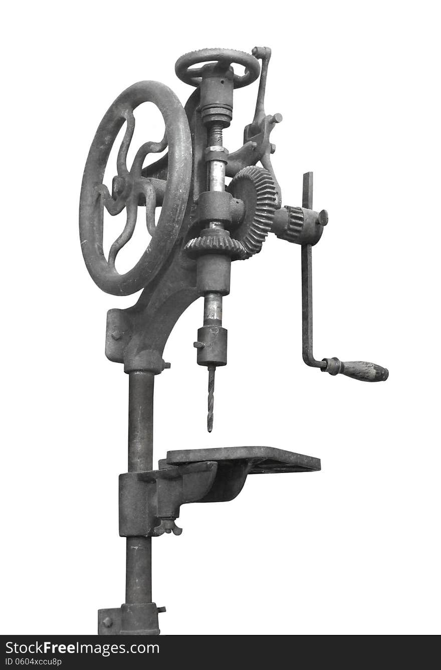 Vintage hand operated woodworking drill press. Isolated on white. Vintage hand operated woodworking drill press. Isolated on white.