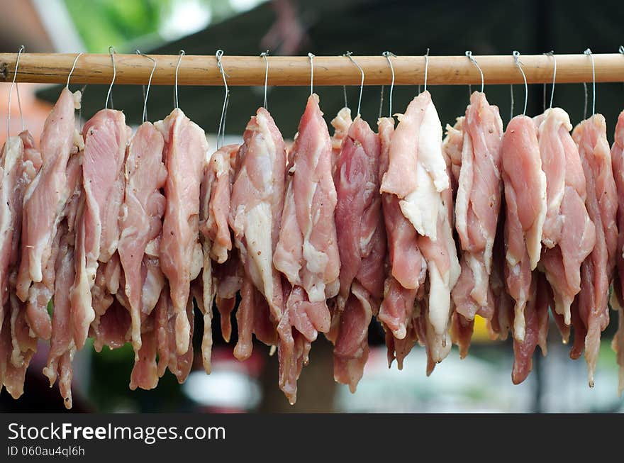 Sun dried beef on the wooden row