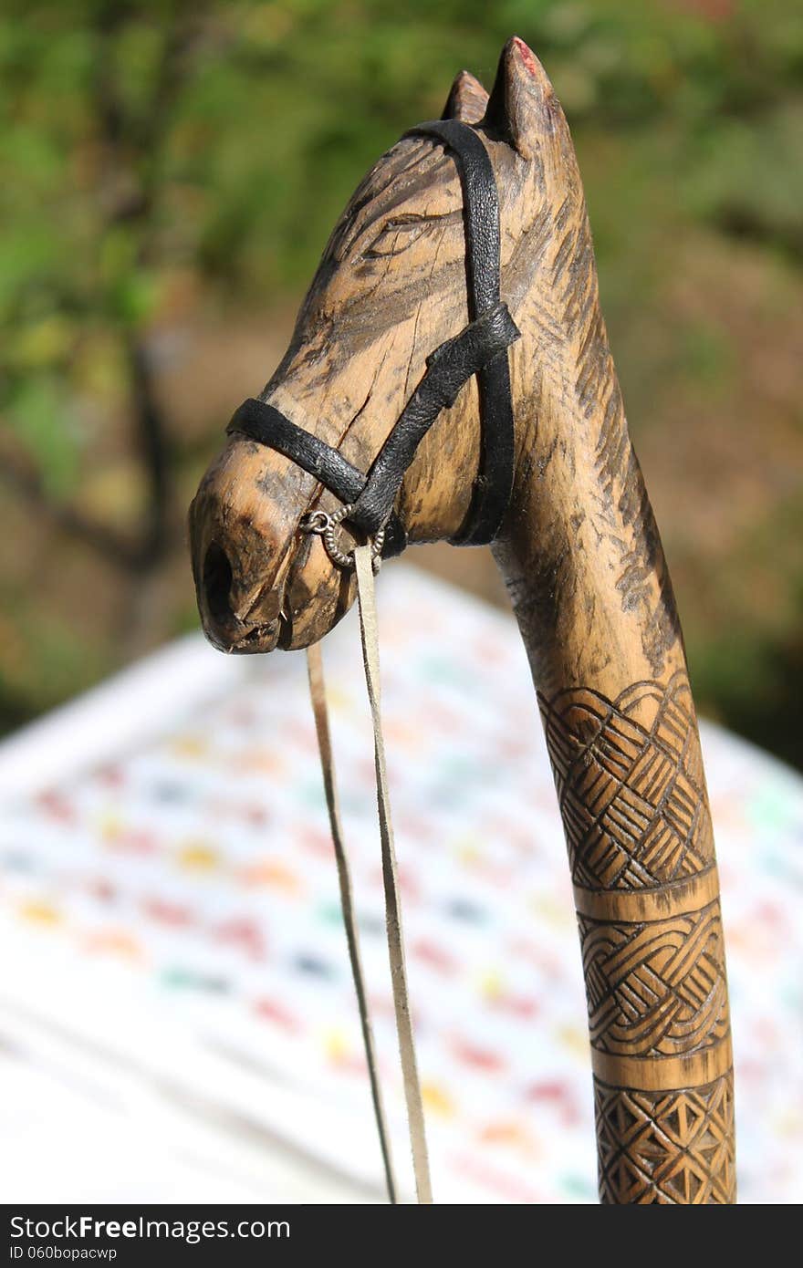 Horse head wood handle carved, engraved and decorated with ham.