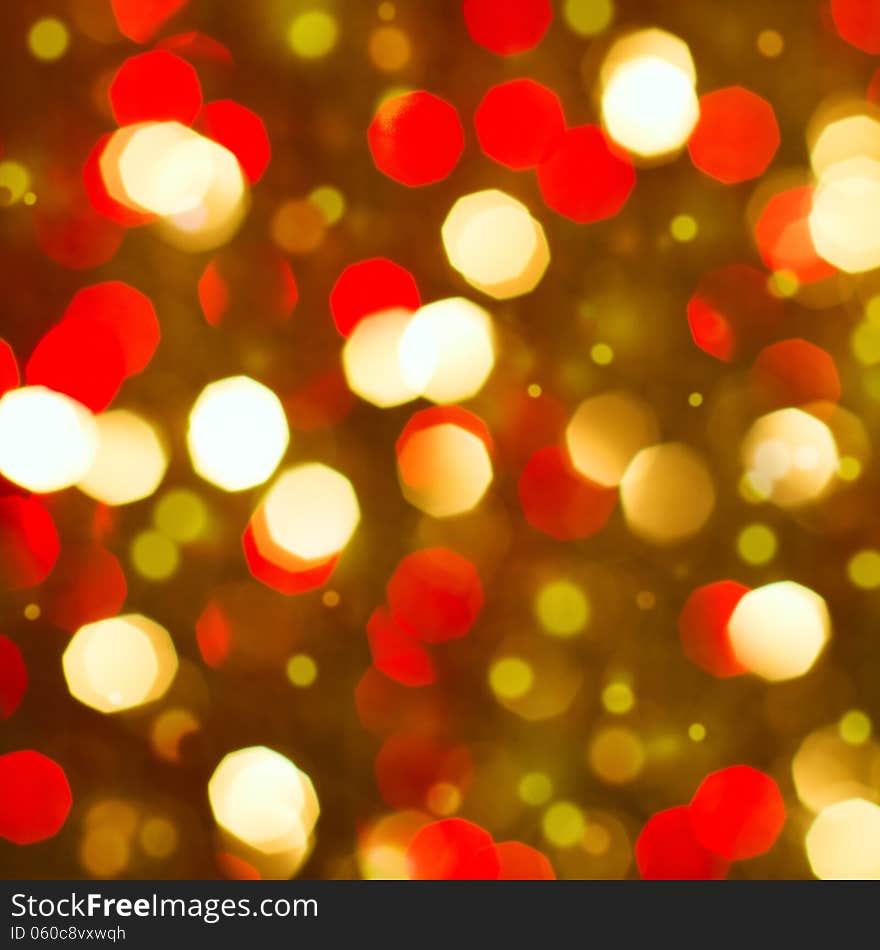 Red golden glowing background. Christmas card. Abstract background with bokeh defocused lights and stars