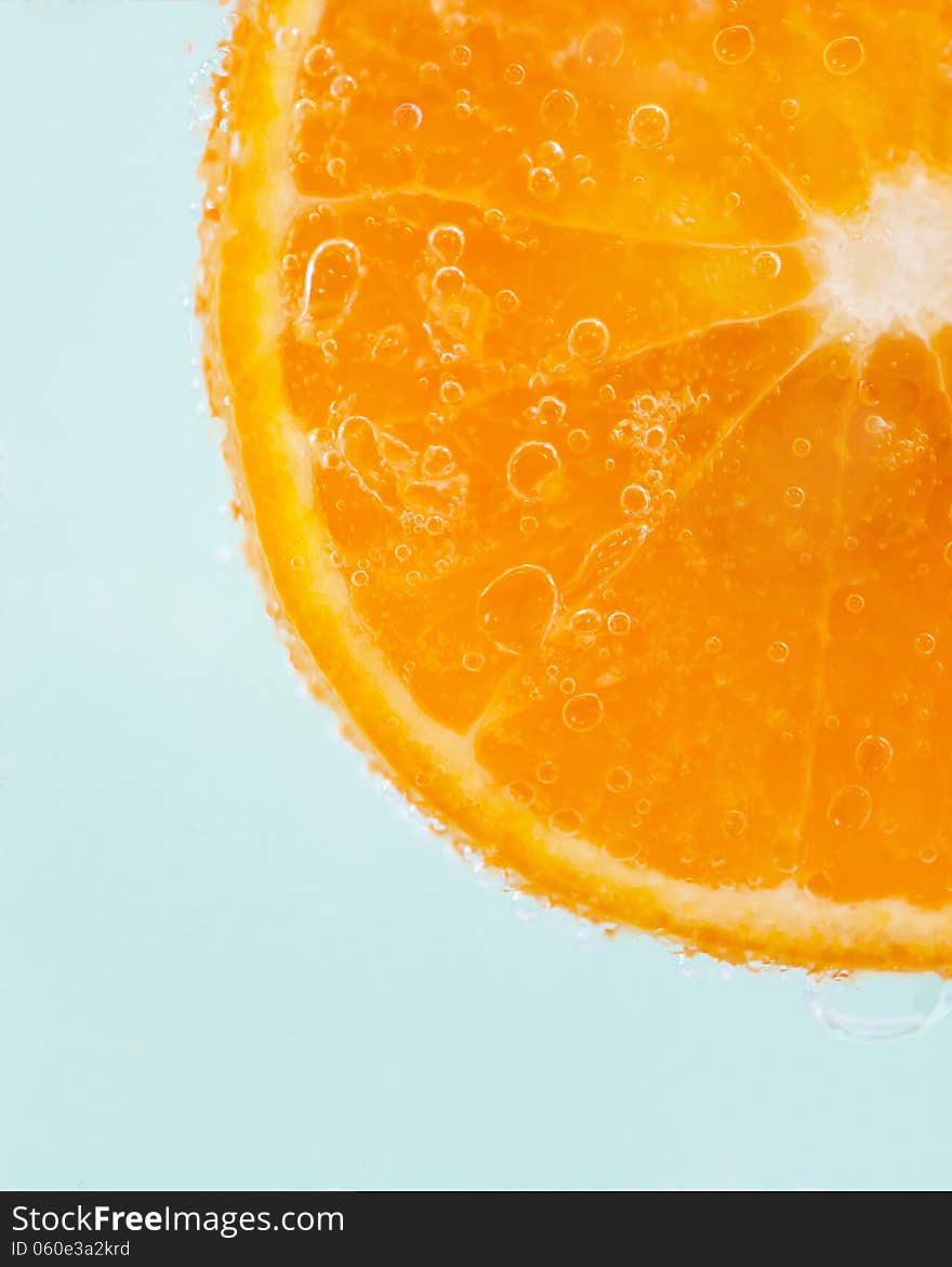 Orange slice and water droplets