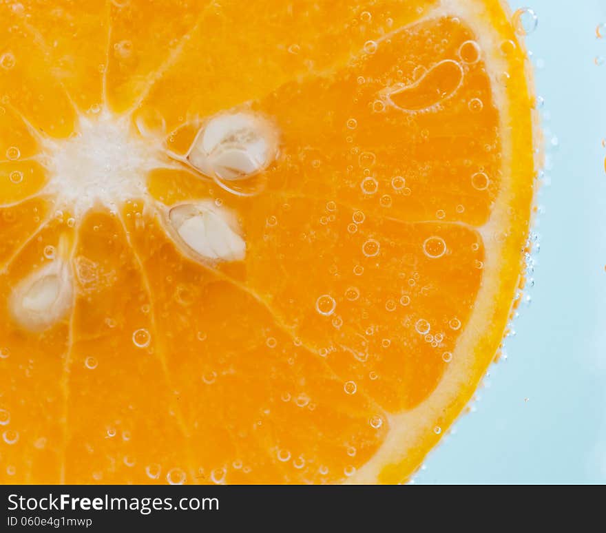 Orange slice and water droplets