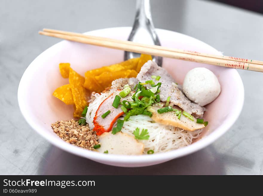 Bowl of traditional Chinese red pork noodles no soup