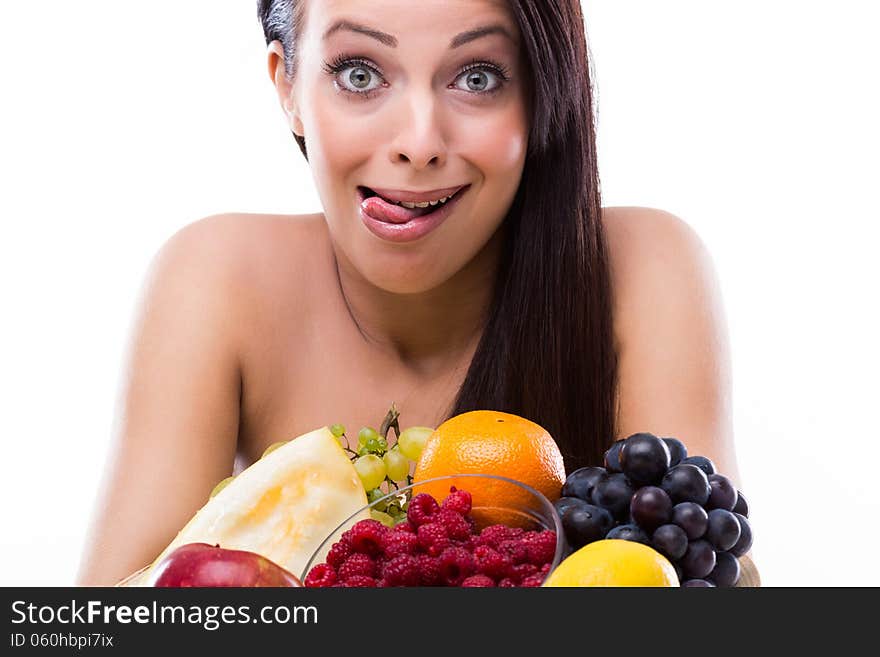 Funny young woman is crazy about fresh fruits