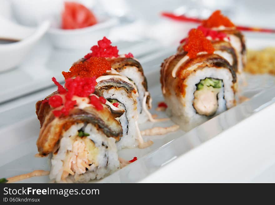 Colorful sushi on the plate in restaurant. Colorful sushi on the plate in restaurant