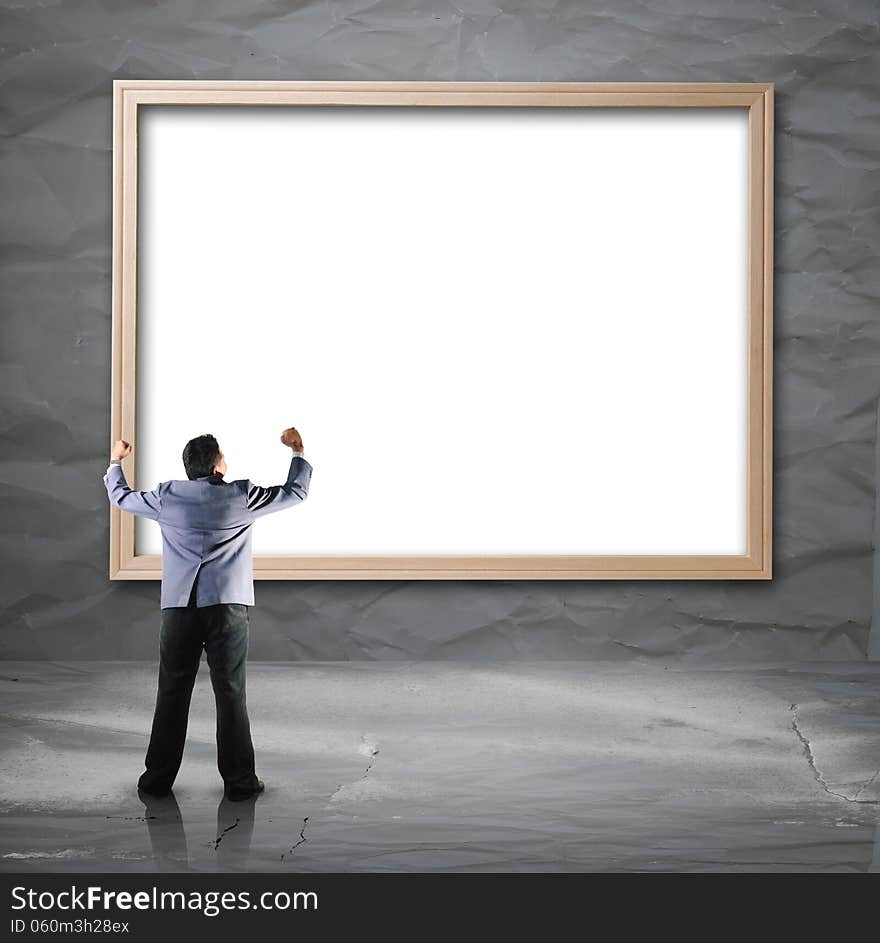 Businessman looking for white backdrop with wooden frame use for background layout design