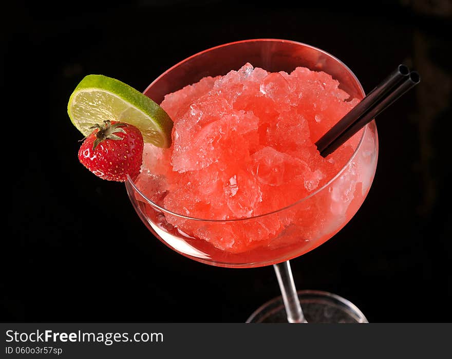 Strawberry margarita cocktail on black background