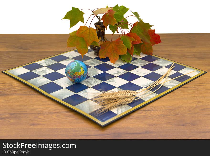 Autumn maple leaves vase chessboard sculpture girls sitting in meditation ears of wheat time blue red green white insulated von still life. Autumn maple leaves vase chessboard sculpture girls sitting in meditation ears of wheat time blue red green white insulated von still life