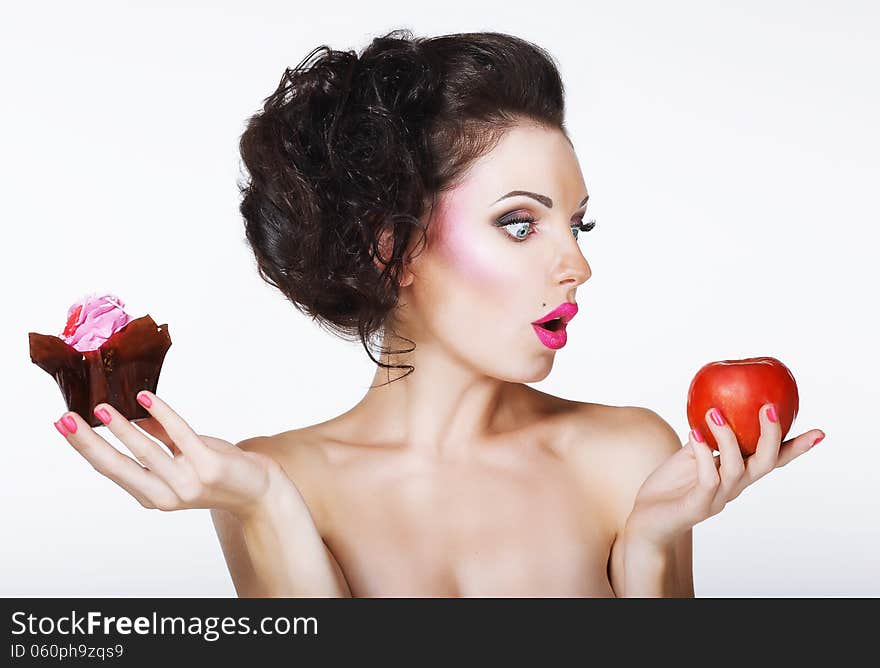 Surprised Funny Woman Decides between Apple and Cake