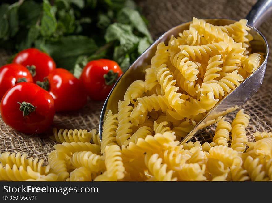 Raw pasta on complex background