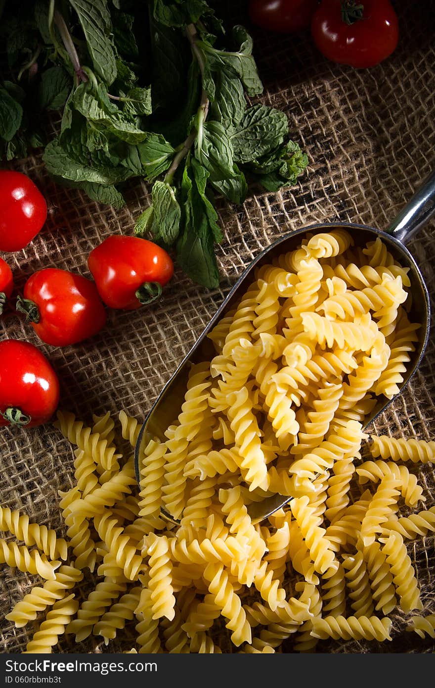 Raw pasta on complex background