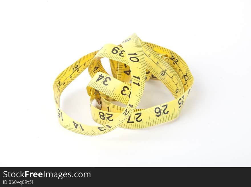 A yellow measuring tape, isolated.