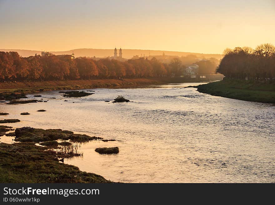 Old town autumn sunrise on the river