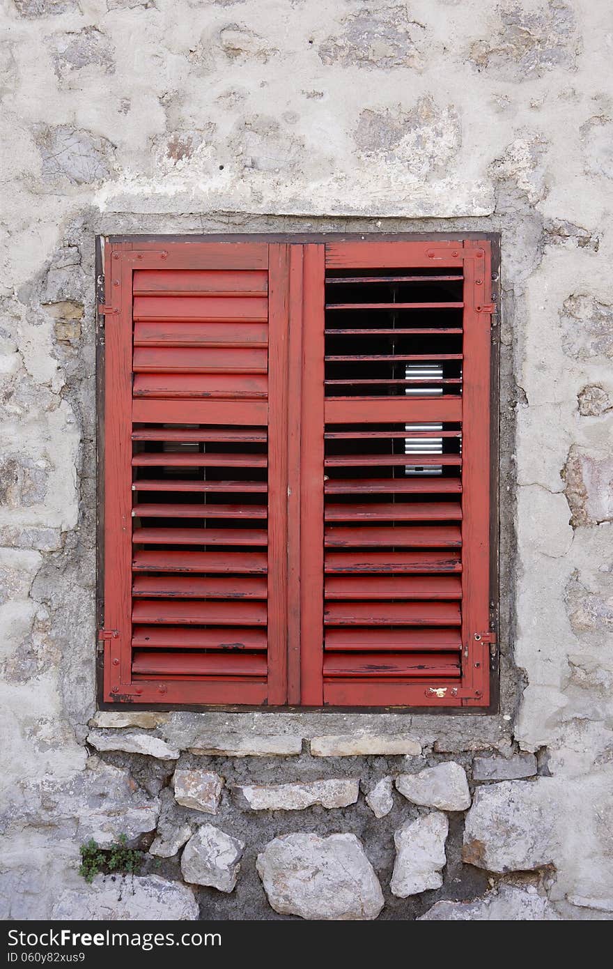 Window with red shutters