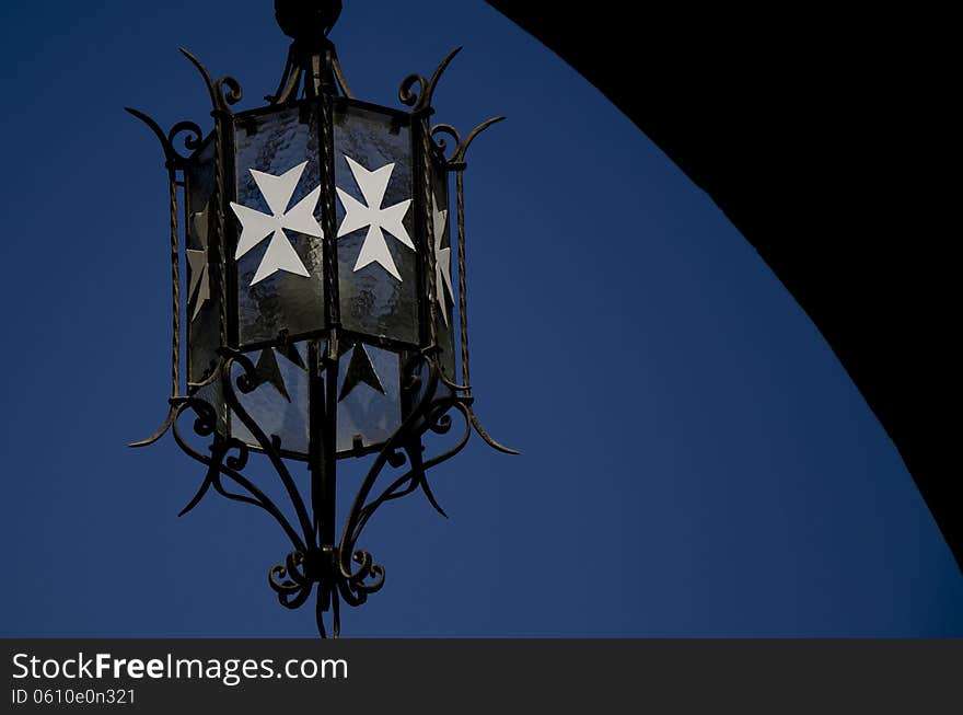 Metal Lantern with White Maltese cross. Metal Lantern with White Maltese cross.