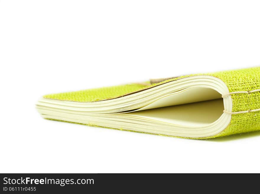 Notebook with a green cover isolated on a white background. Notebook with a green cover isolated on a white background