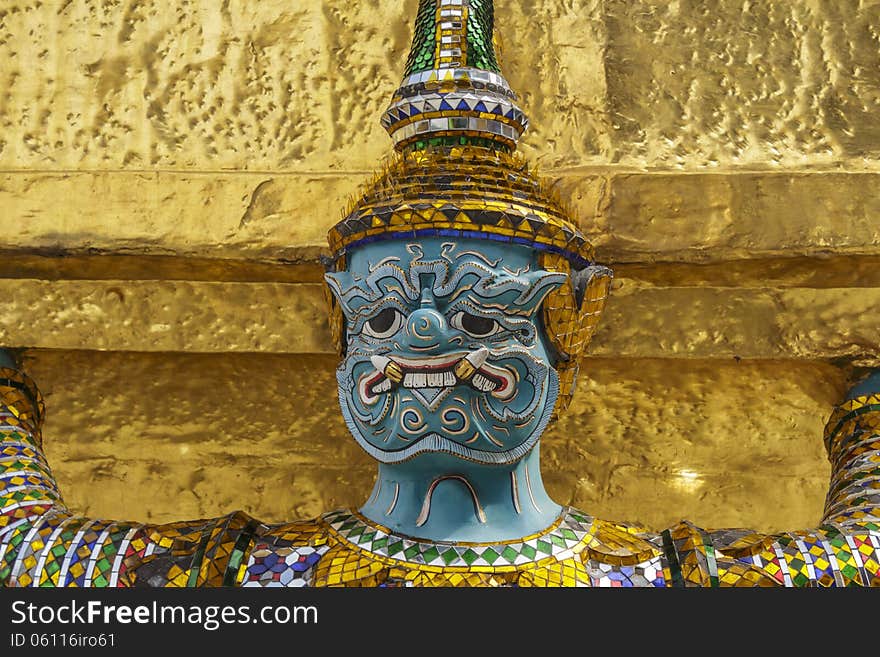 Statue of a giant security,Native Thai style in Wat Phra Kaew, Bangkok (Thailand).Generality in Thailand, any kind of art decorated in Buddhist church, temple pavilion, temple hall, monk's house etc. created with money donated by people to hire artist. They are public domain or treasure of Buddhism, no restrict in copy or use, no name of artist appear (but, if there is artist name, it only for tell who is the artist of work, not for copyright). This photo is taken under these conditions. Statue of a giant security,Native Thai style in Wat Phra Kaew, Bangkok (Thailand).Generality in Thailand, any kind of art decorated in Buddhist church, temple pavilion, temple hall, monk's house etc. created with money donated by people to hire artist. They are public domain or treasure of Buddhism, no restrict in copy or use, no name of artist appear (but, if there is artist name, it only for tell who is the artist of work, not for copyright). This photo is taken under these conditions.