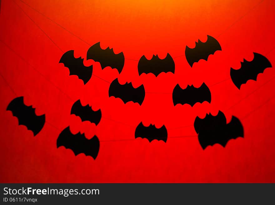 Halloween paper garlands on orange background. Halloween paper garlands on orange background