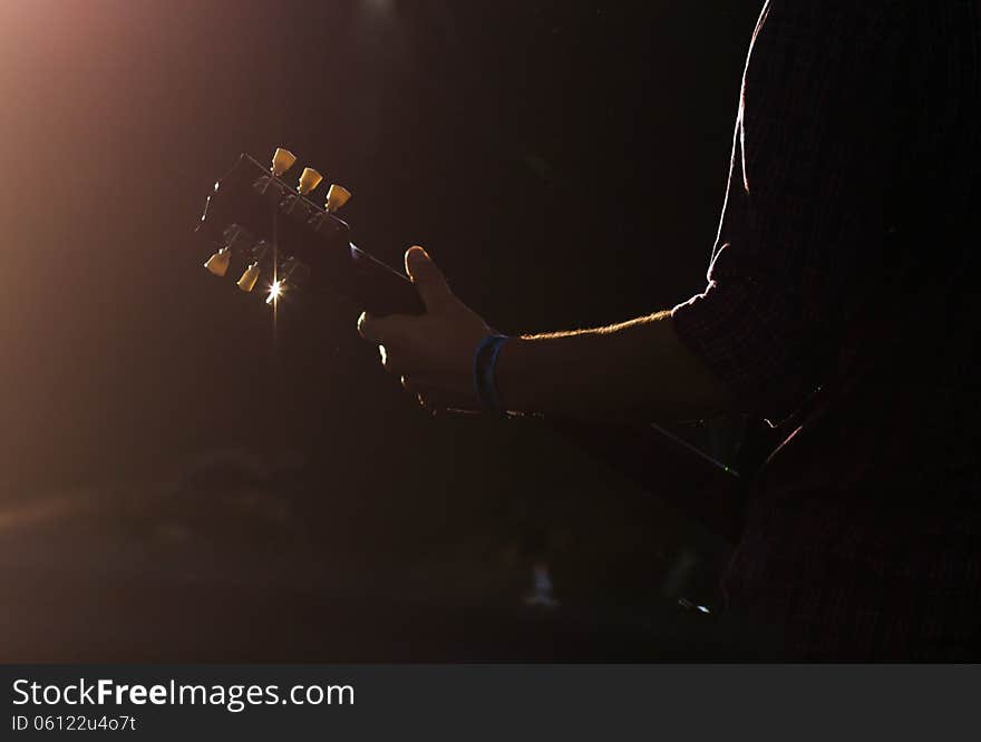 Guitarist silhouette performing on stage. Guitarist silhouette performing on stage