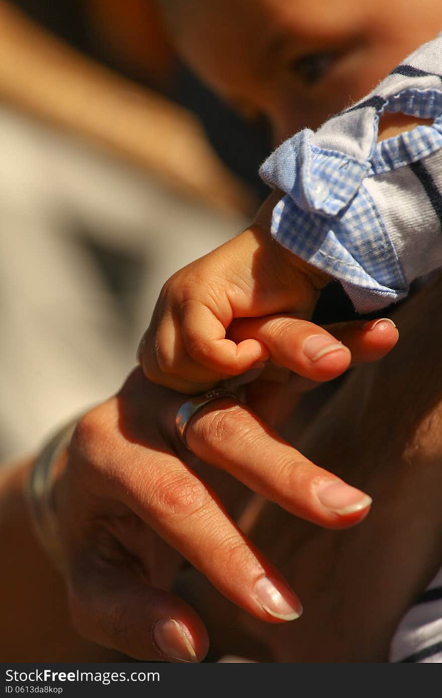 Baby Hand holding mother finger. Baby Hand holding mother finger