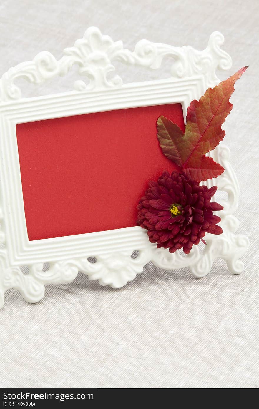 Vintage photo frame chrysanthemum and autumnal a maple leaf