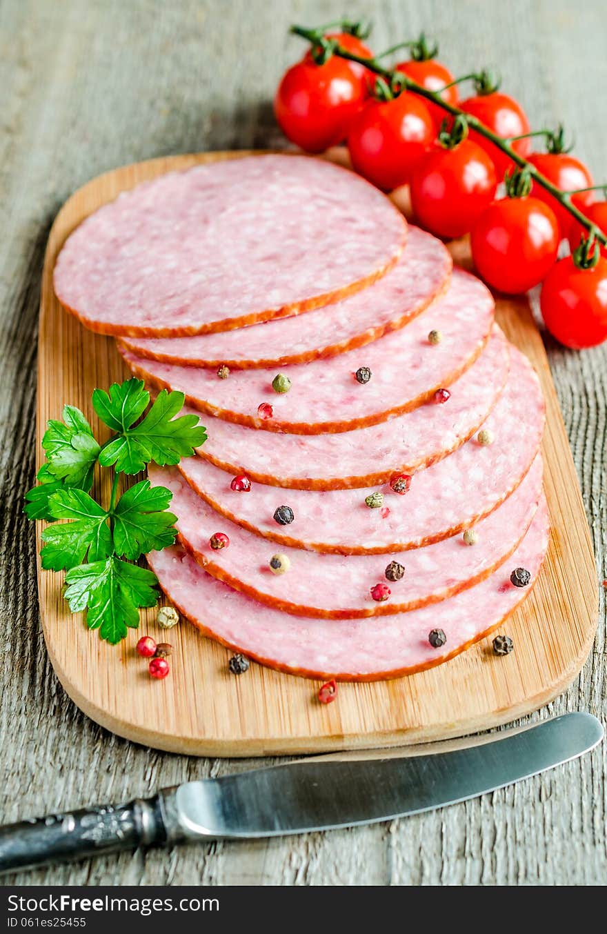 Sliced salami on the cutting board