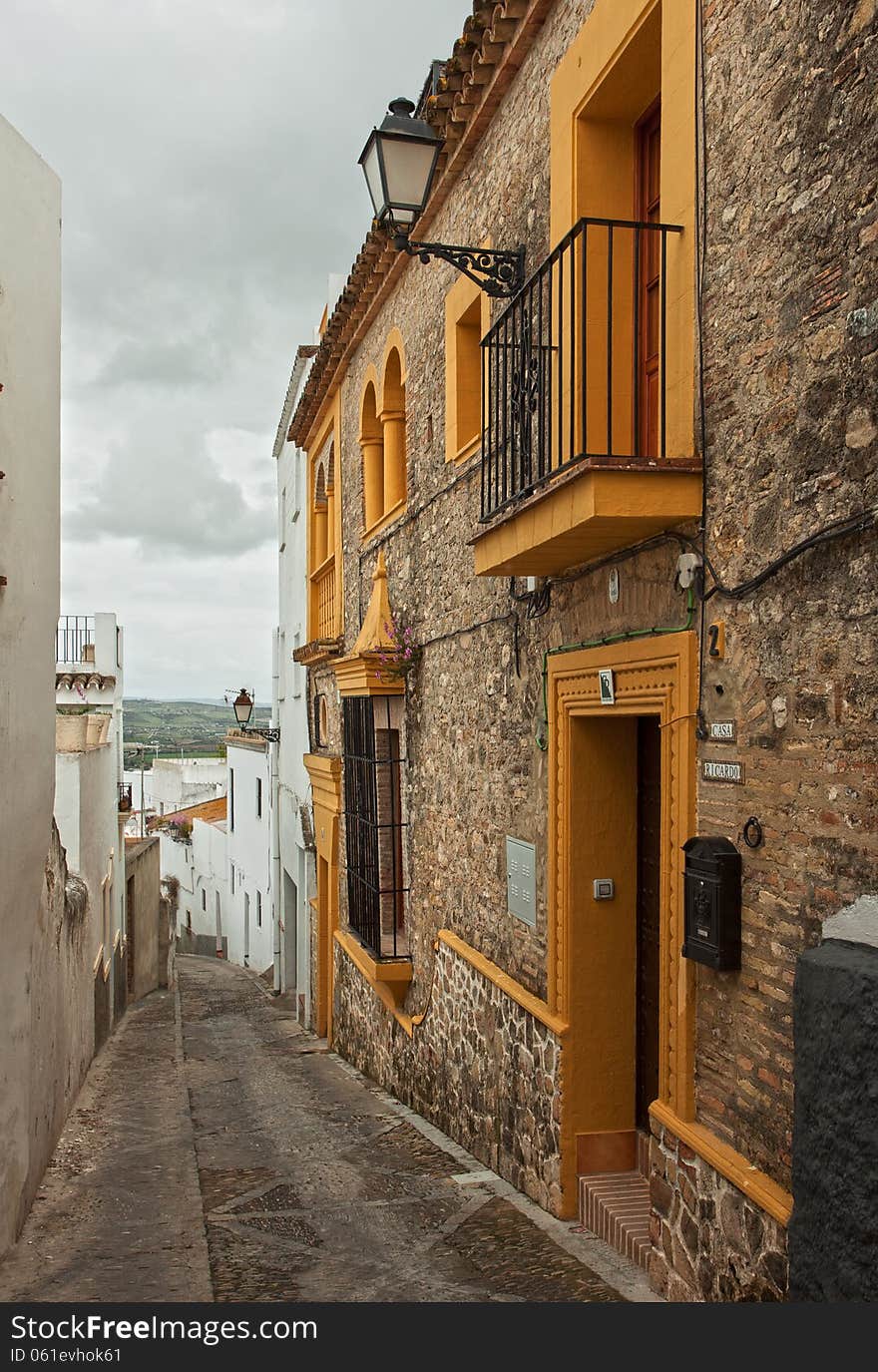 The narrow street with old houses, Arcos de la Frontera, Andalusia, Spain.