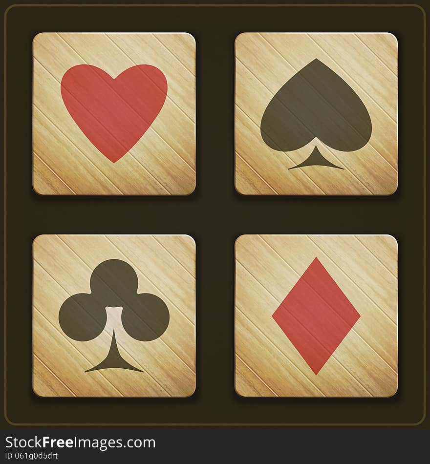 New set of wooden buttons with cards suits symbols on dark background. New set of wooden buttons with cards suits symbols on dark background