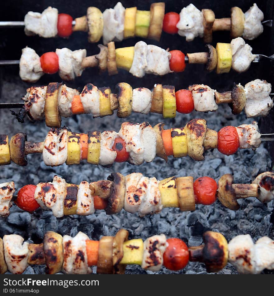 Shashlik with chicken and vegetable.Grilled meat and vegetables.