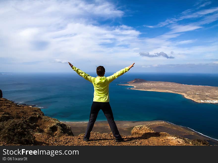 Tourist woman on the top of rock