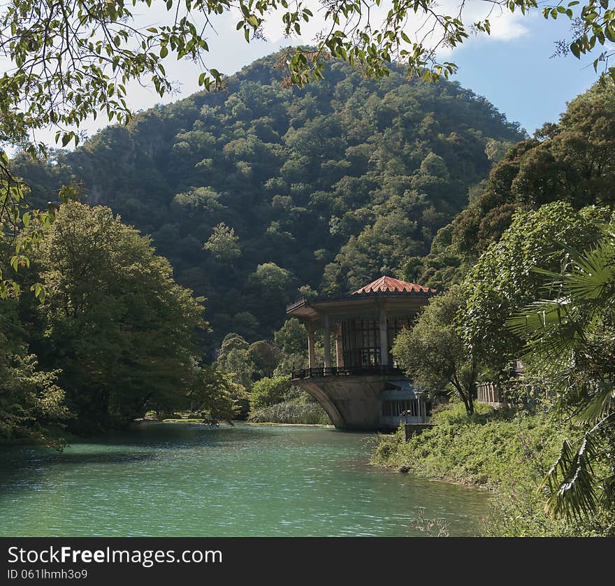 House on the banks of the river in the mountains