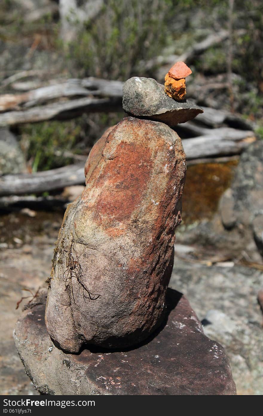 A stone man, symbolizing a safe onward journey, is often encountered in the bushland of the Grampians National Park. To some it's just a stack of rocks, to others the perfect balance amongst the surrounding stones represents Zen. A stone man, symbolizing a safe onward journey, is often encountered in the bushland of the Grampians National Park. To some it's just a stack of rocks, to others the perfect balance amongst the surrounding stones represents Zen