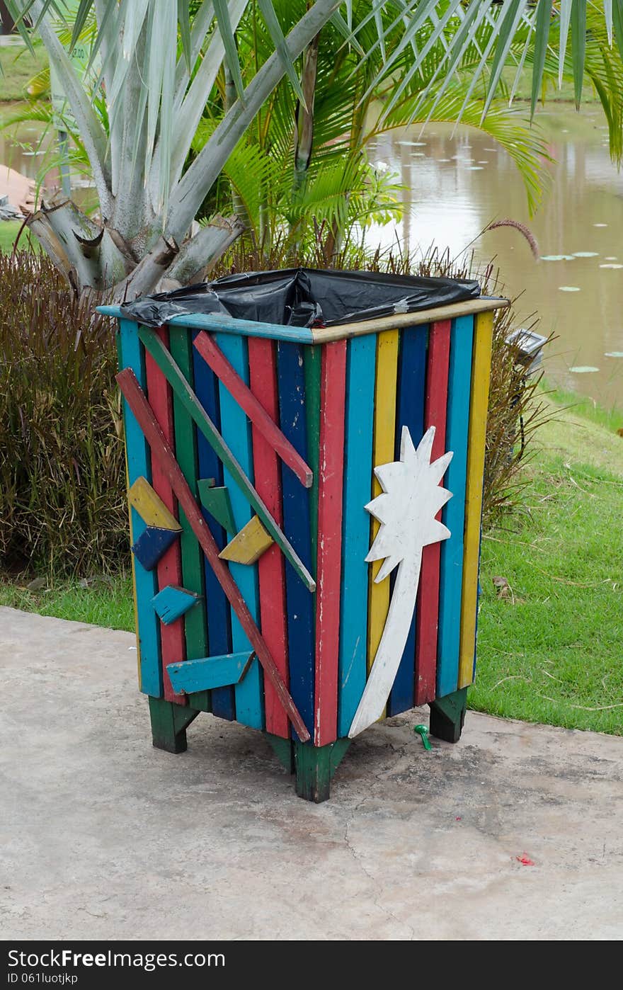 Colorful bin in the park. Trash container