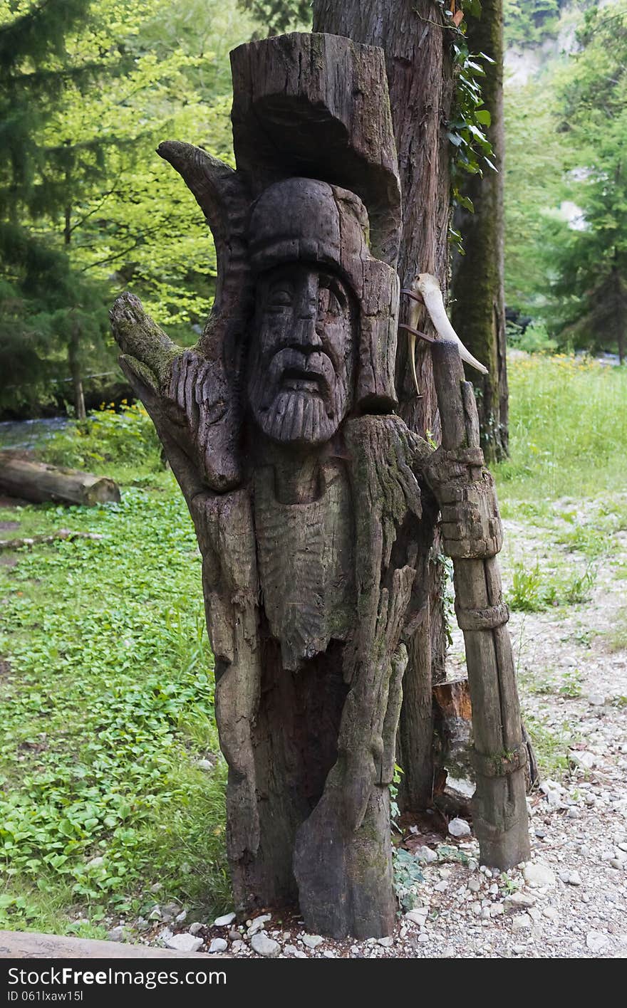 Wooden slavic idol in the forest