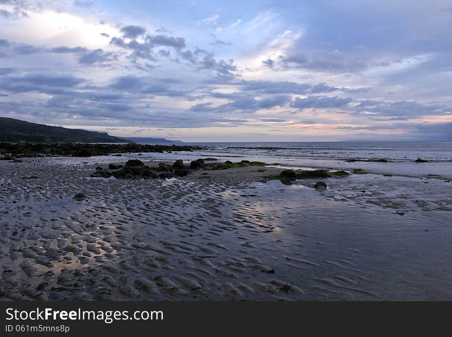 The Rock Strewn Ballygally Beach and Ballygally Bay, beautiful in early morning light