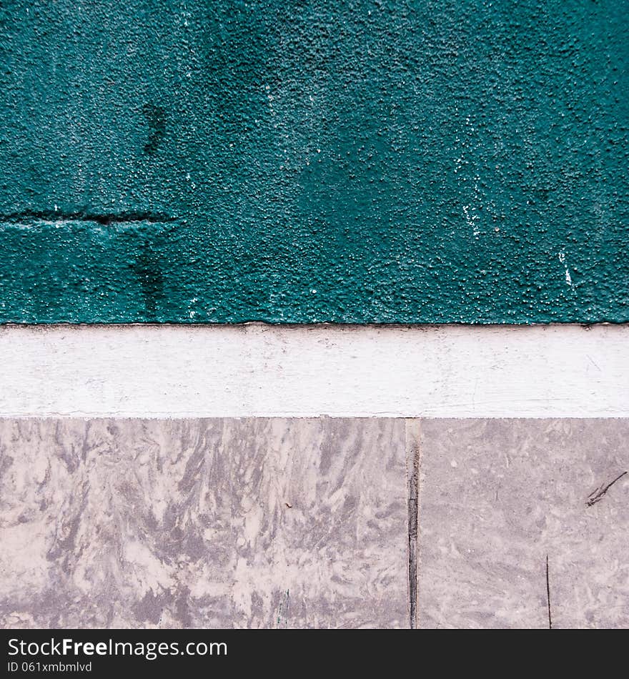 Closeup of a turquoise, grey and white facade of a house. Closeup of a turquoise, grey and white facade of a house