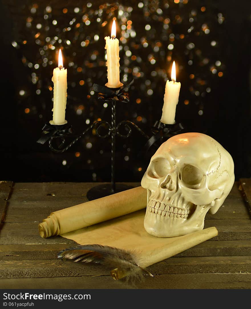 Candelabra with skull and letter