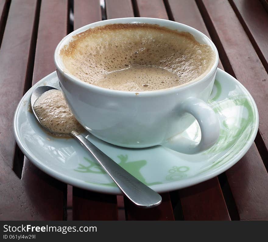 Coffe with white cup on red table. Coffe with white cup on red table