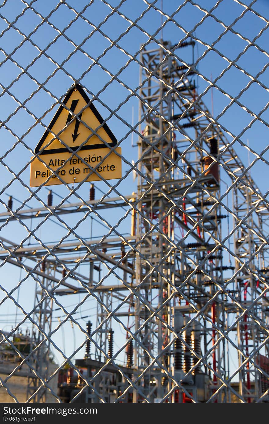 Signal of danger of death metal grille fence of electrical distribution center. Signal of danger of death metal grille fence of electrical distribution center