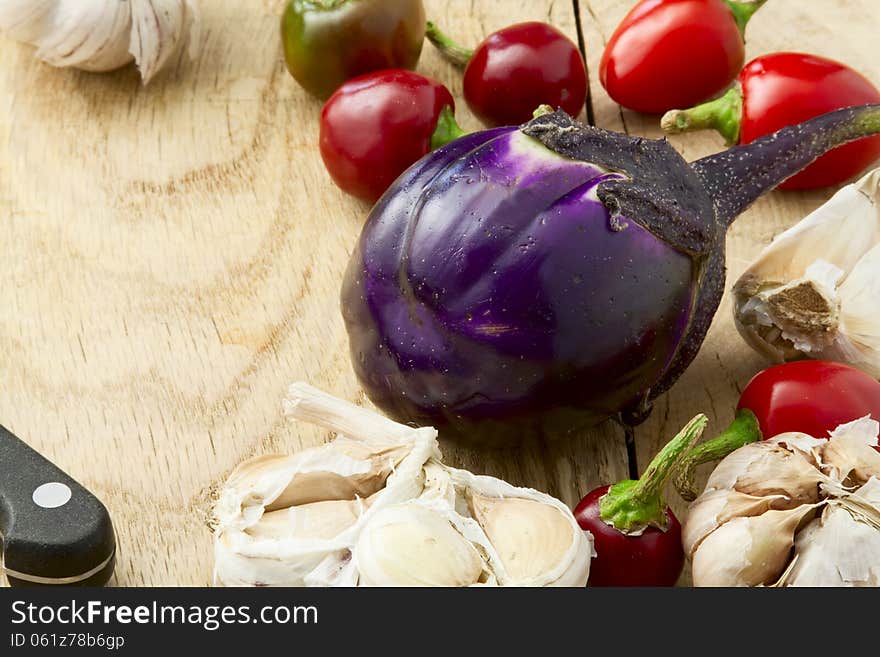 Ripe eggplant bitter red peppers and garlic. Ripe eggplant bitter red peppers and garlic