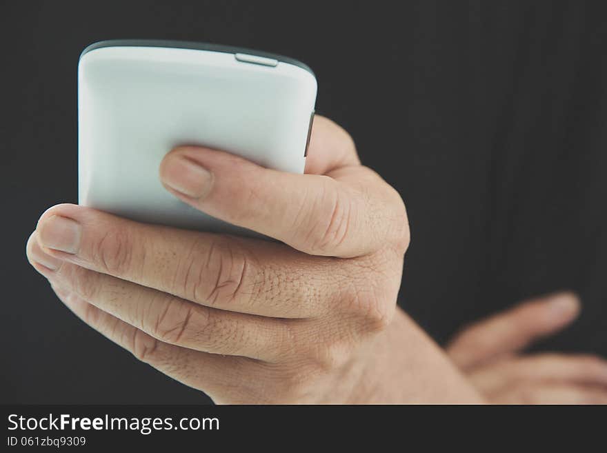 Image of man checking his phone