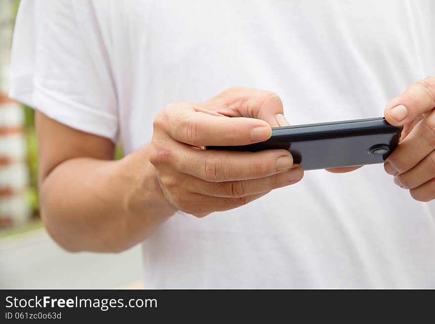 Image of man checking his phone