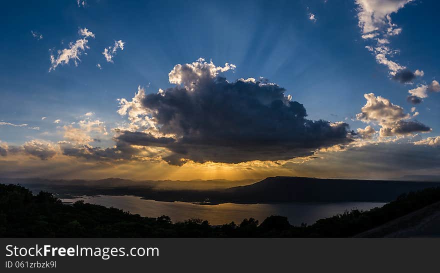 Clouds sun shine ray through. Clouds sun shine ray through